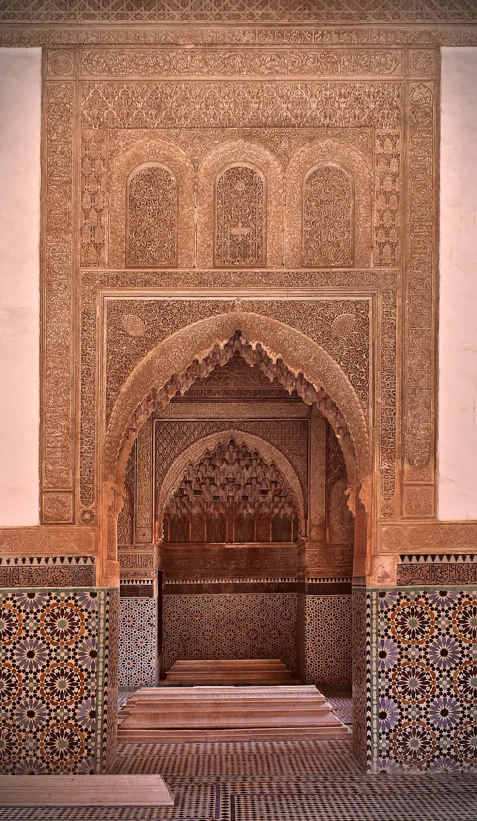 Carved stucco mihrab arch with muqarnas hood at the Saadian Tombs, sealed from 1672 to 1917