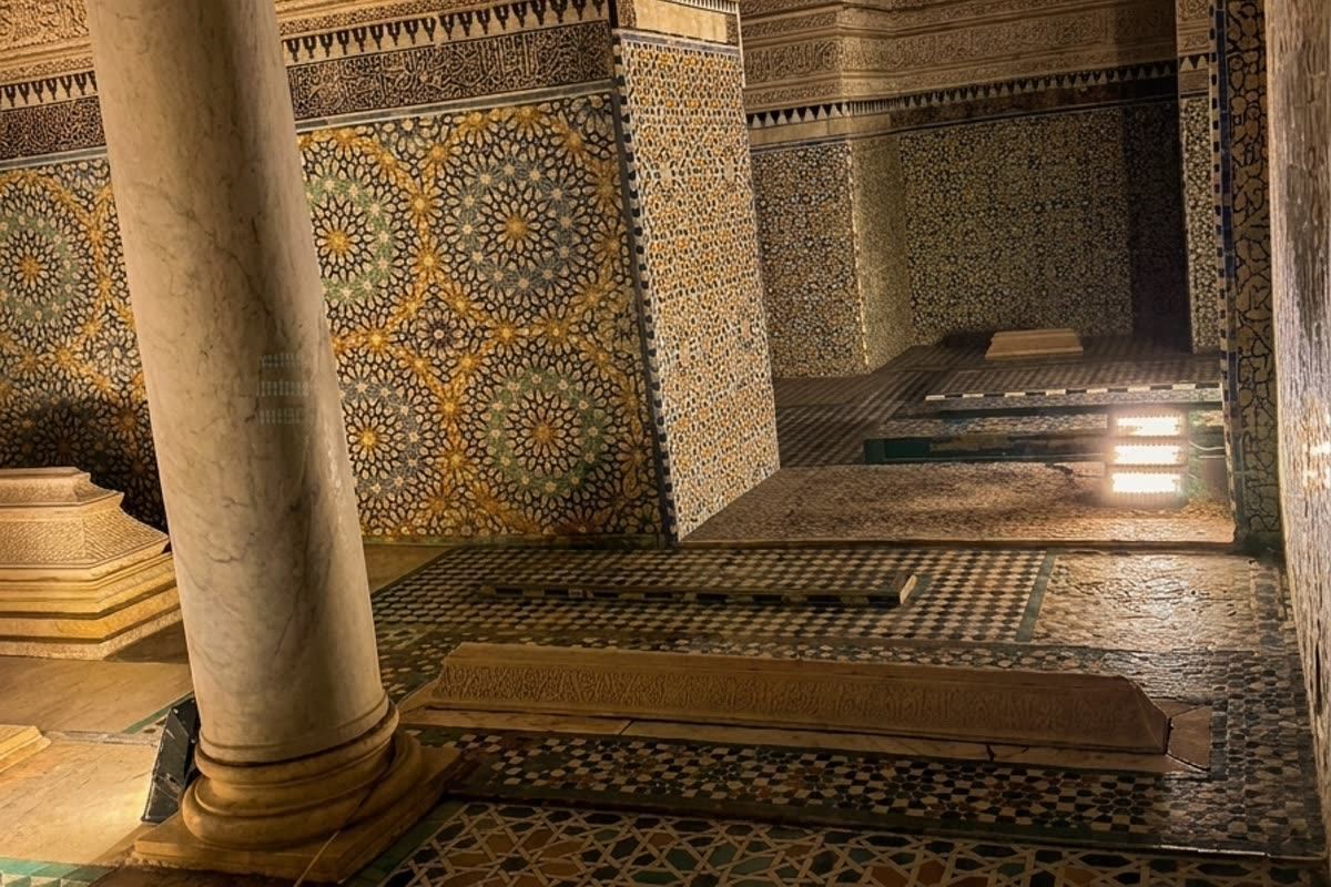 Zellige-tiled marble tombstones marking graves at the Saadian Tombs
