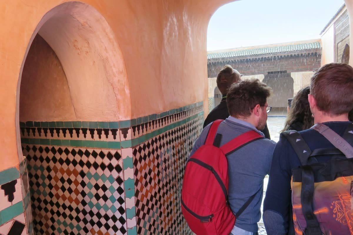 Visitors viewing the tilework and tombs inside the Saadian Tombs