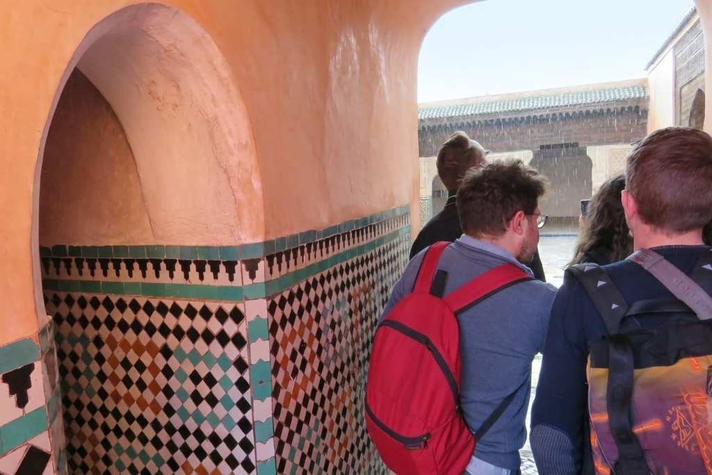 Visitors viewing the tilework and tombs inside the Saadian Tombs